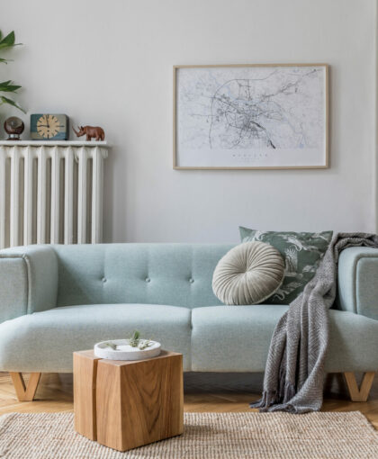 Stylish scandinavian living room interior with design mint sofa,
