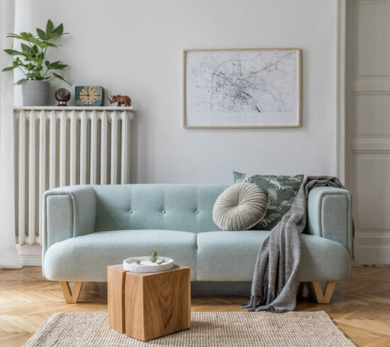 Stylish scandinavian living room interior with design mint sofa,