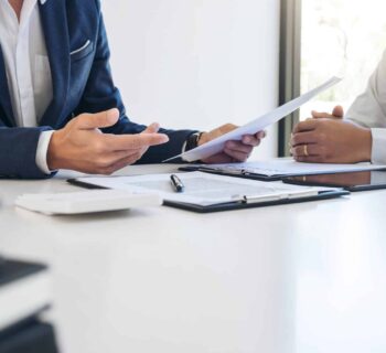 Agent man presentation and consulting car insurance detail to customer and waiting for his reply to finish.